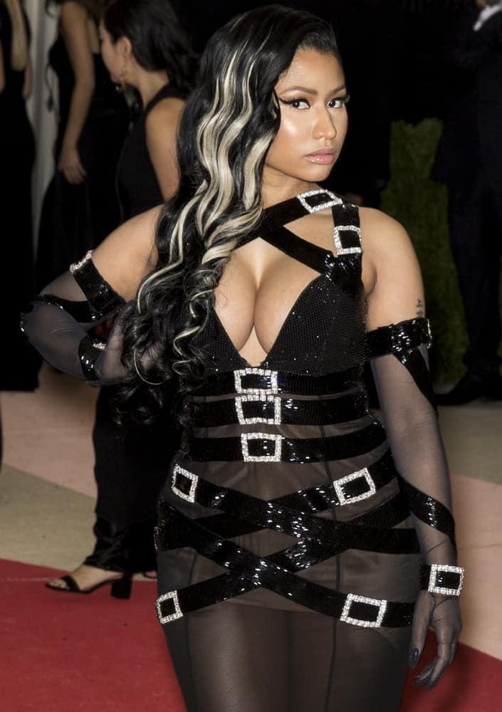 On May 2, 2016, Nicki Minaj attended the Manus x Machina Fashion in an Age of Technology Costume Institute Gala at the Metropolitan Museum of Art in New York. She went with a black sheer outfit to pair with her side-swept curly raven hairstyle with blond highlights.