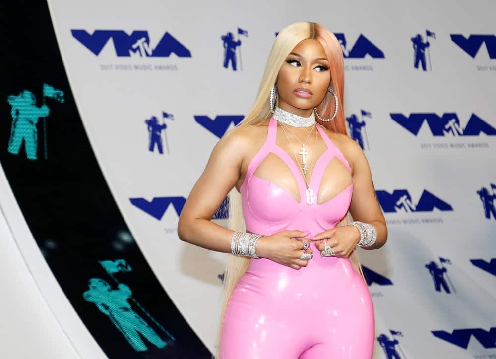 Nicki Minaj wore a body-hugging pink latex jumpsuit that she paired with her long and straight loose blond hairstyle at the 2017 MTV Video Music Awards held at the Forum in Inglewood, USA on August 27, 2017.