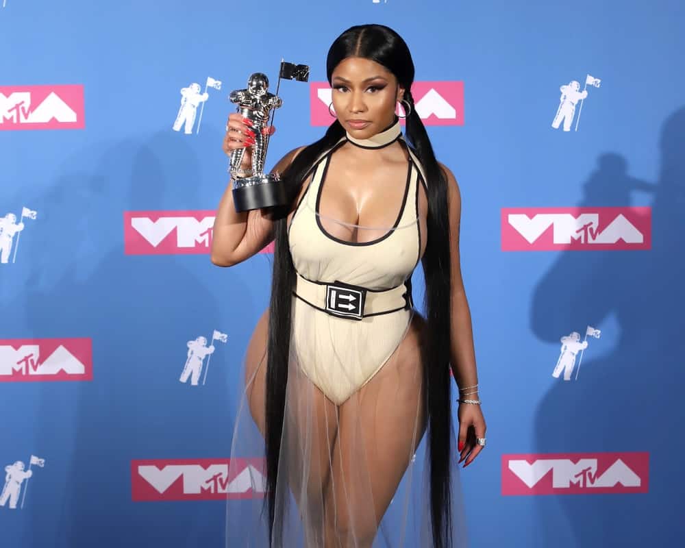 Nicky Minaj attended the MTV Video Music Awards at Radio City Music Hall on August 20, 2018, in New York. She complemented her sexy curves with a long and straight raven hairstyle styled into twin ponytails.