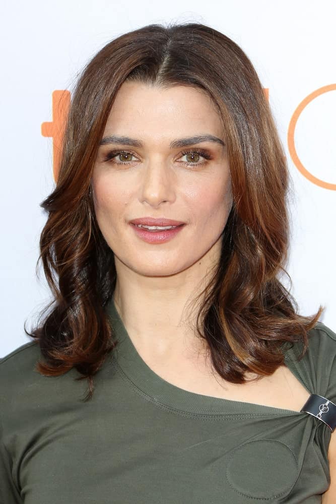 Rachel Weisz at 'The Lobster' Premiere during the 2015 Toronto International Film Festival on September 11, 2015. She styled her shoulder-length locks with twirl curls that are accented with brown highlights for a dramatic appeal.