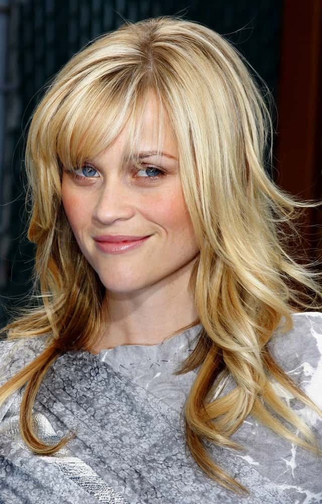 Reese Witherspoon's tousled and highlighted loose blond hairstyle had wispy bangs at the Los Angeles premiere of 'Monsters vs. Aliens' held at the Gibson Amphitheatre in Universal City on March 22, 2009.