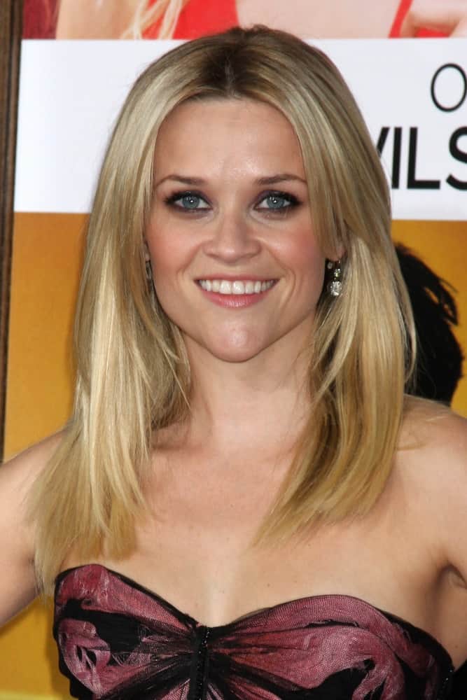 Reese Witherspoon was quite charming in her strapless dress and loose, layered and straight sandy blond hairstyle at Heather Tom's Annual Christmas Party 2010 at the Village Theater on December 13, 2010 in Westwood, CA.
