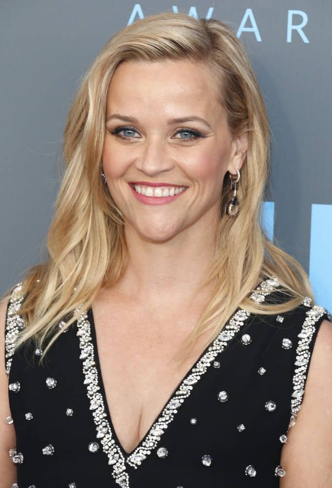 Reese Witherspoon went with a simple look to her loose and side-swept blond layered hairstyle to pair with her black bejeweled dress at the 23rd Annual Critics' Choice Awards held at the Barker Hangar in Santa Monica, USA on January 11, 2018.
