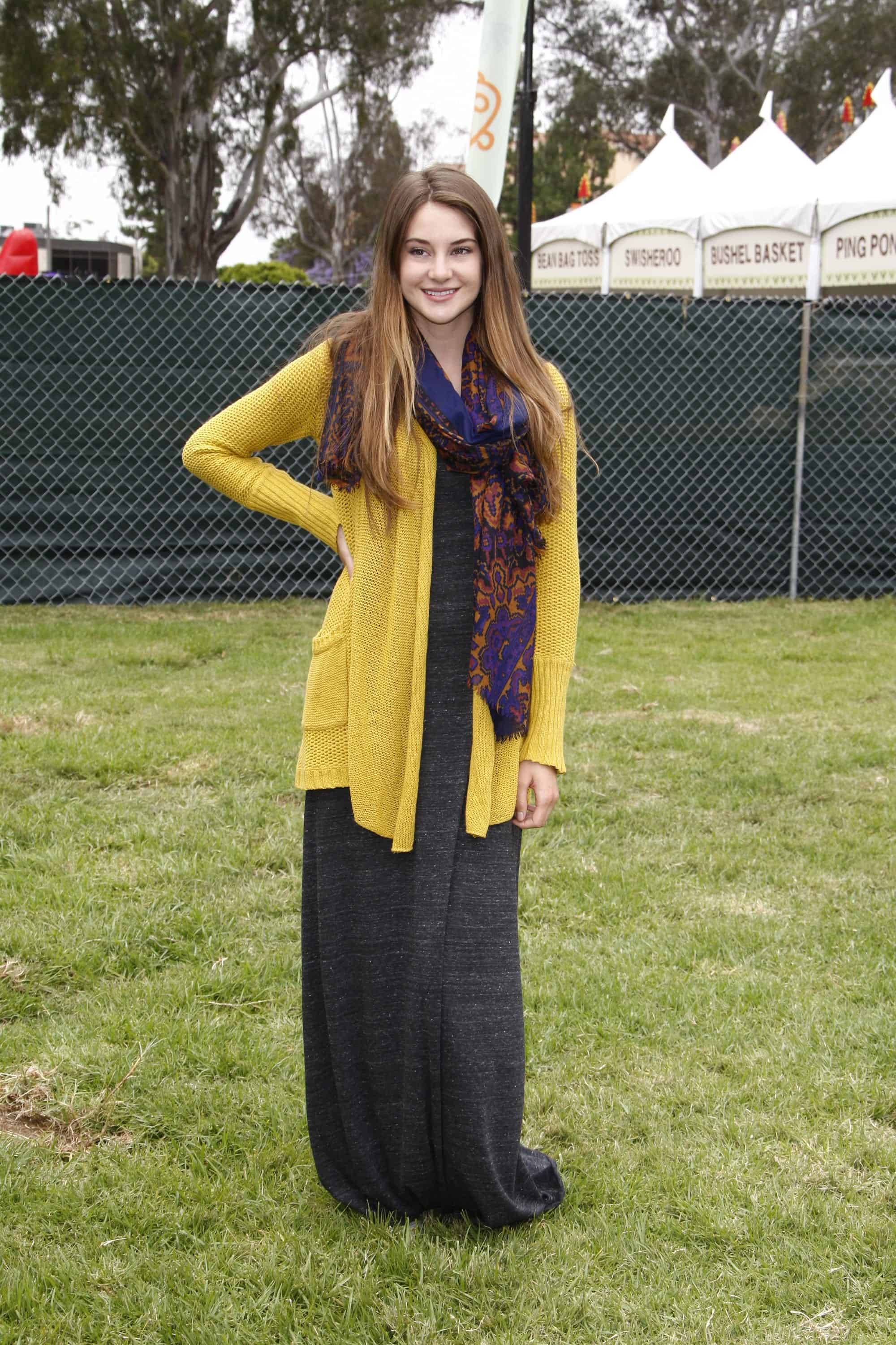 Shailene Woodley was at the 22nd Annual 'Time for Heroes' Celebrity Picnic at Wadsworth Theater on June 12, 2011 in Westwood, CA. She wore a yellow cardigan and a colorful scarf with her long and loose tousled brunette hairstyle that has highlights.