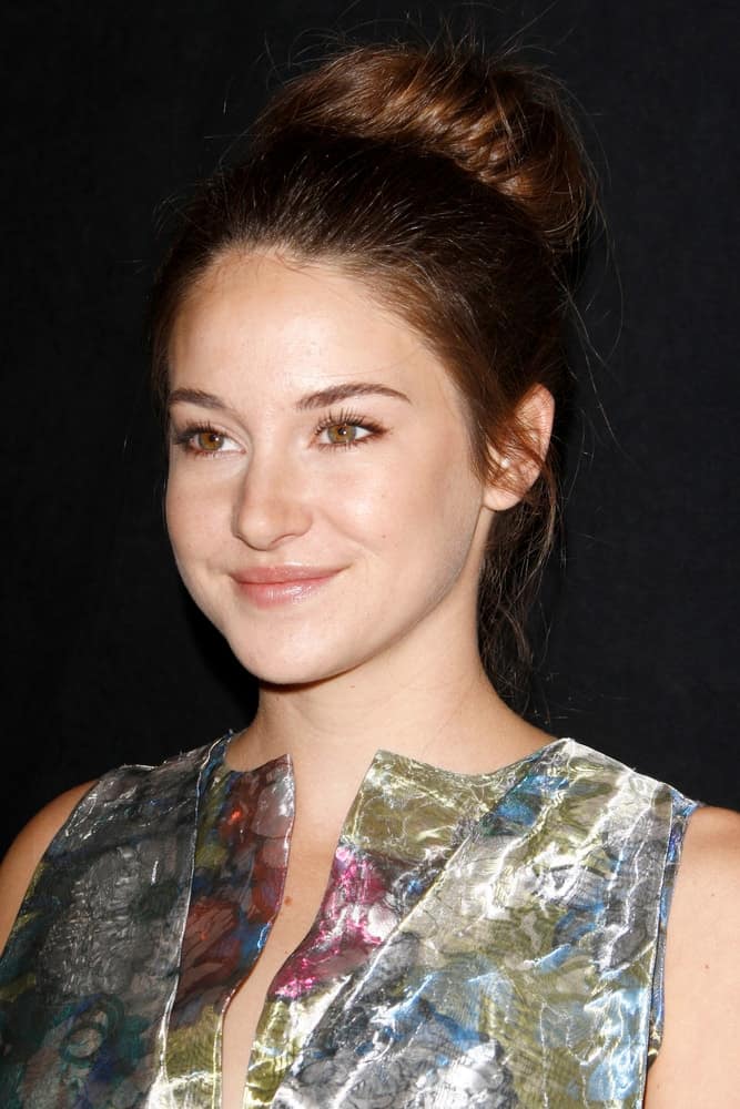 Shailene Woodley attended the 37th Los Angeles Film Critics Association Awards at the InterContinental Hotel on January 13, 2012 in Century City, CA. She wore a metallic dress to pair with her large bun hairstyle with loose tendrils.