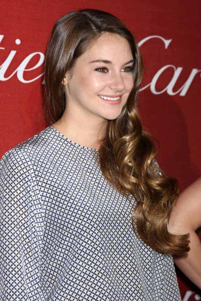Shailene Woodley was at the 2012 Palm Springs International Film Festival Gala at Palm Springs Convention Center on January 7, 2012, in Palm Springs, CA. She paired her patterned dress with an elegant long side-swept brunette hairstyle with a curly finish.