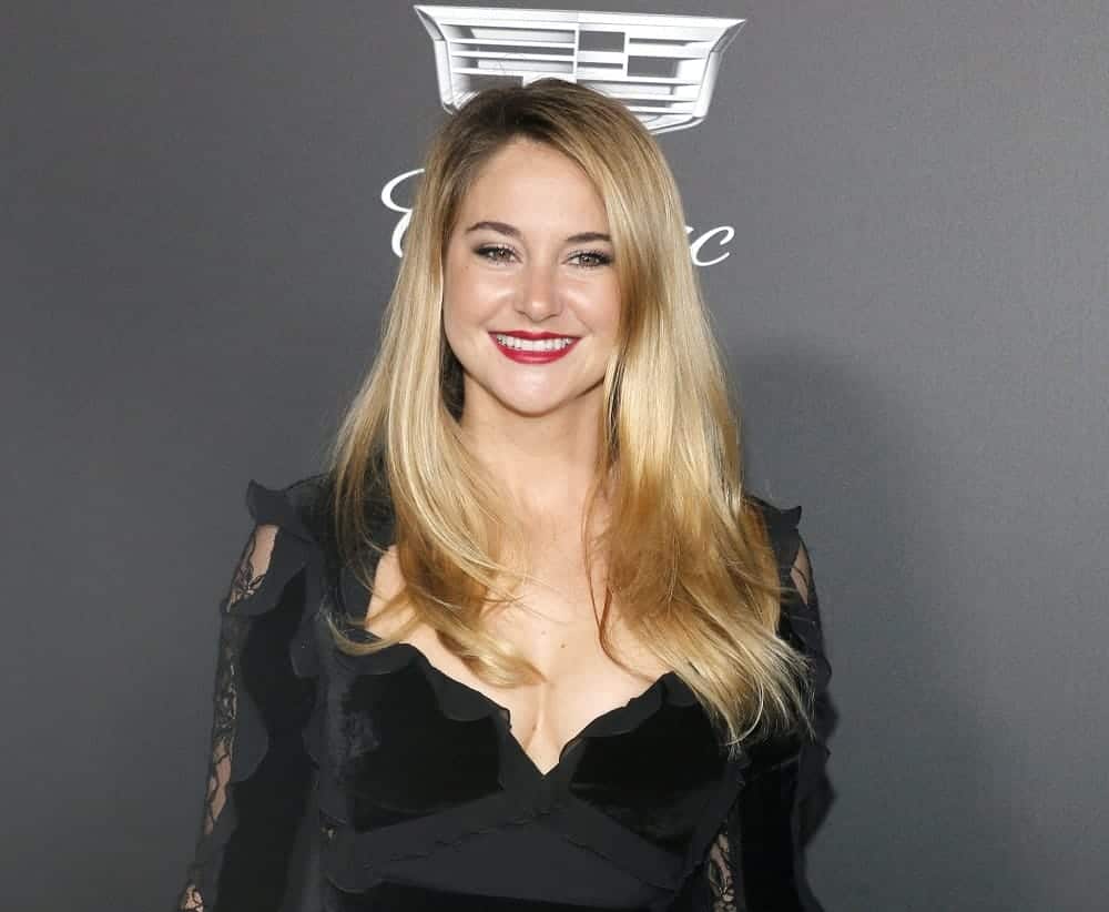 Shailene Woodley was at the Art Of Elysium's 11th Annual Heaven Celebration held at the Barker Hangar in Santa Monica on January 6, 2018. She was charming in a black dress that she paired with her long and loose sandy blonde hairstyle with a slight tousle and layers.