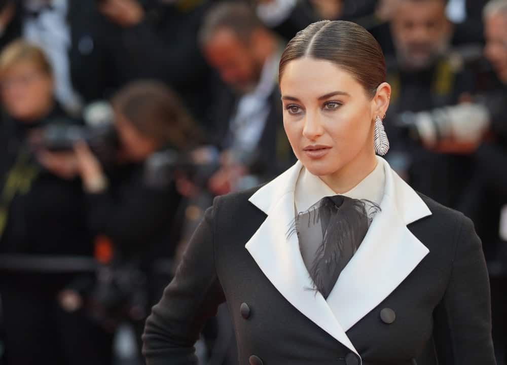 Shailene Woodley attended the screening of "Rocket Man" during the 72nd annual Cannes Film Festival on May 16, 2019 in Cannes, France. She was elegant in a black and white smart casual outfit to pair with her slicked back brunette bun hairstyle.