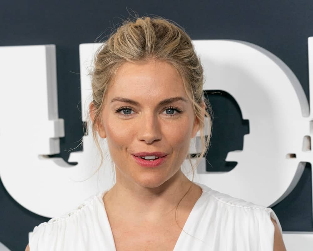 Sienna Miller is a goddess in this brushed back upstyle with loose strands at the Showtime network premiere of The Loudest Voice on June 24, 2019. She completed the look with a white dress by Oscar de la Renta.