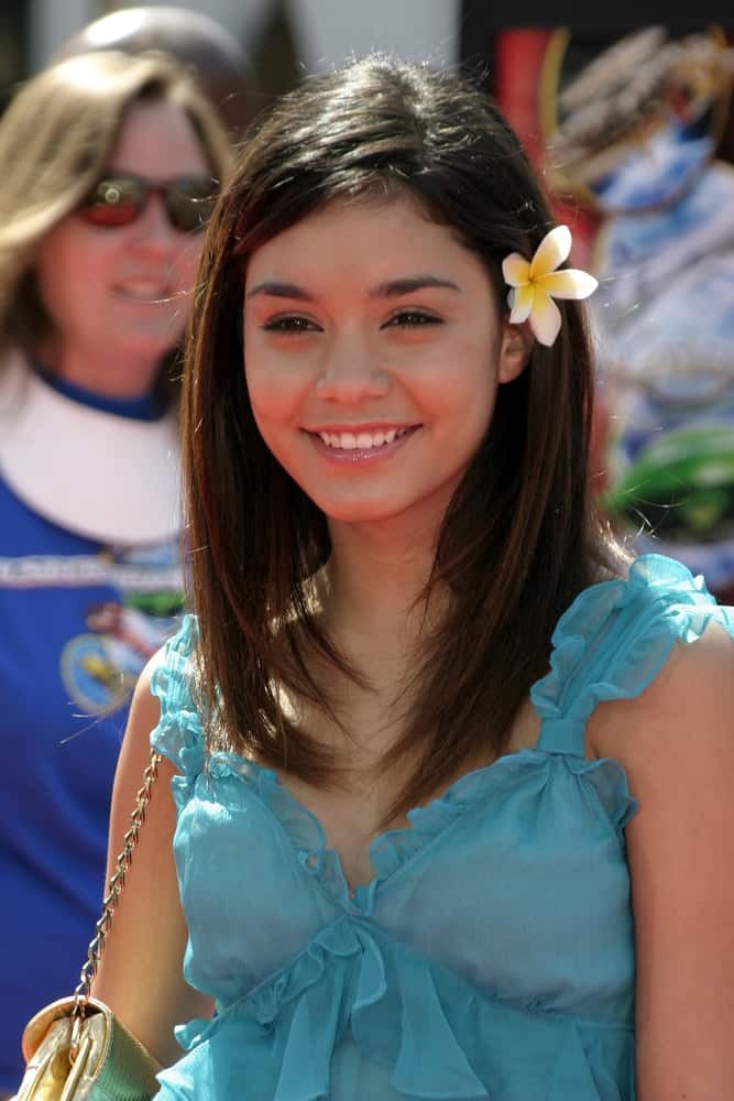 A young Vanessa Anne Hudgens attended the "Thunderbirds" Premiere held at the Universal Studios Cinemas in Universal City, California on July 24, 2004. She was lovely in her blue outfit to pair with her medium-length straight hair incorporated with a flower on the side.