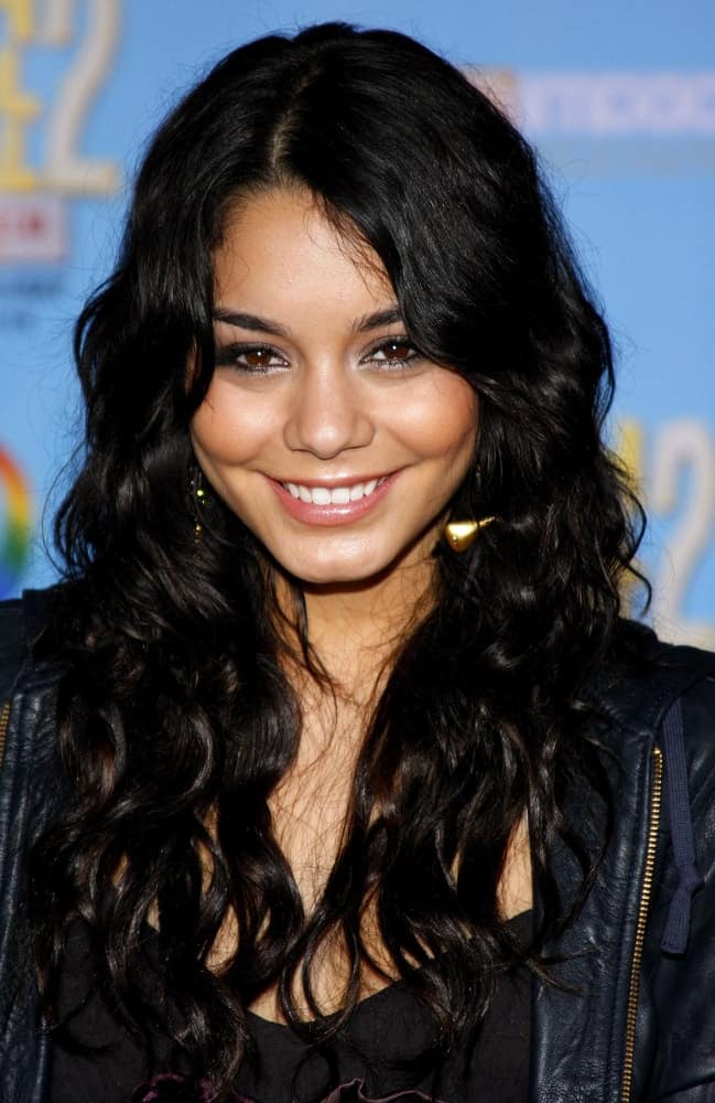 Vanessa Hudgens attended the DVD Release Premiere of "High School Musical 2: Extended Edition" held at the El Capitan Theater in Hollywood, California on November 19, 2007. She was seen wearing a casual dark outfit to match with her loose and tousled wavy raven hairstyle with subtle layers.