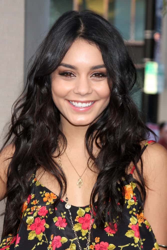 Vanessa Hudgens wore a black floral outfit that went quite perfectly with her long and loose wavy raven hairstyle at the Legend of the Guardians: The Owls of Ga'Hoole Premiere at Grauman's Chinese Theater on September 19, 2010 in Los Angeles, CA.