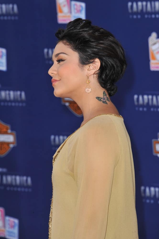 Vanessa Hudgens was at the premiere of "Captain America: The First Avenger" at the El Capitan Theatre, Hollywood on July 19, 2011 Los Angeles, CA. She was charming in her tan sheer outfit to go with her brushed back short raven hairstyle.