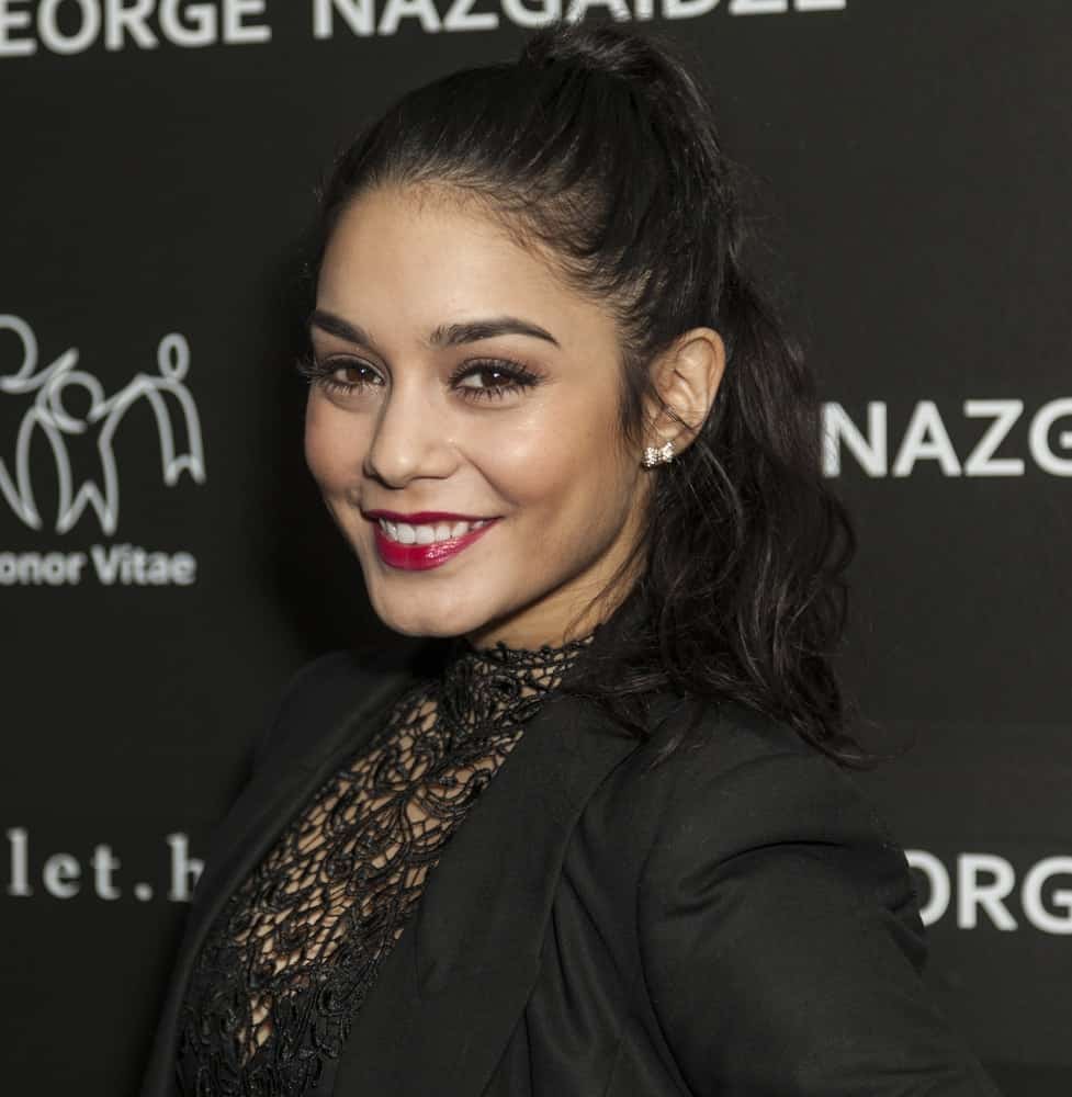 Vanessa Hudgens's bold red lips paired quite nicely with her black outfit and high ponytail that has wavy raven tips at the Honor Vitae Charity Meets Fashion Holiday fundraiser for Well-Being of Children in Evolving Countries at Affirmation Arts on December 17, 2012 in New York City.