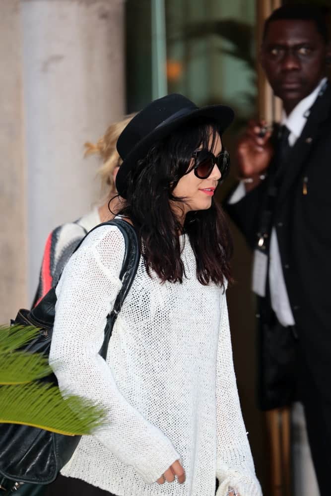 Vanessa Hudgens was at the Venice Film Festival on September 04, 2012 in Venice, Italy. She was seen arriving in casual clothes that she paired with a tousled and loose medium-length hairstyle with a shiny raven tone.