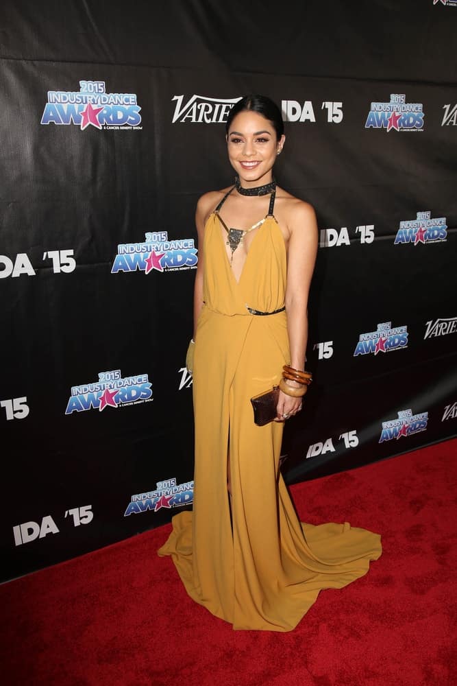 Vanessa Hudgens was quite stunning in her long mustard yellow dress that went perfectly well with her slick center-parted hairstyle at the 2015 Industry Dance Awards and Cancer Benefit Show at the Avalon on August 19, 2015 in Los Angeles, CA.