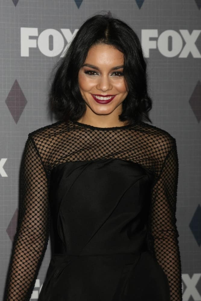 Vanessa Hudgens went for a simple look to her black dress that she paired with her simple make-up and loose shoulder-length hairstyle that has a slight tousle and waves at the tips at the FOX Winter TCA 2016 All-Star Party at the Langham Huntington Hotel on January 15, 2016 in Pasadena, CA.