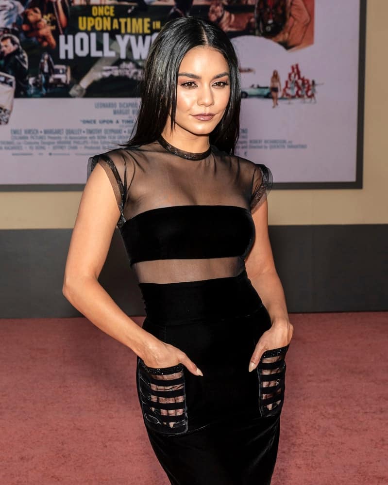 On July 22, 2019, Vanessa Hudgens wore a very fashionable black dress with long and straight black hairstyle with subtle layers at The Los Angeles Premiere Of "Once Upon a Time in Hollywood" held at TCL Chinese Theatre.