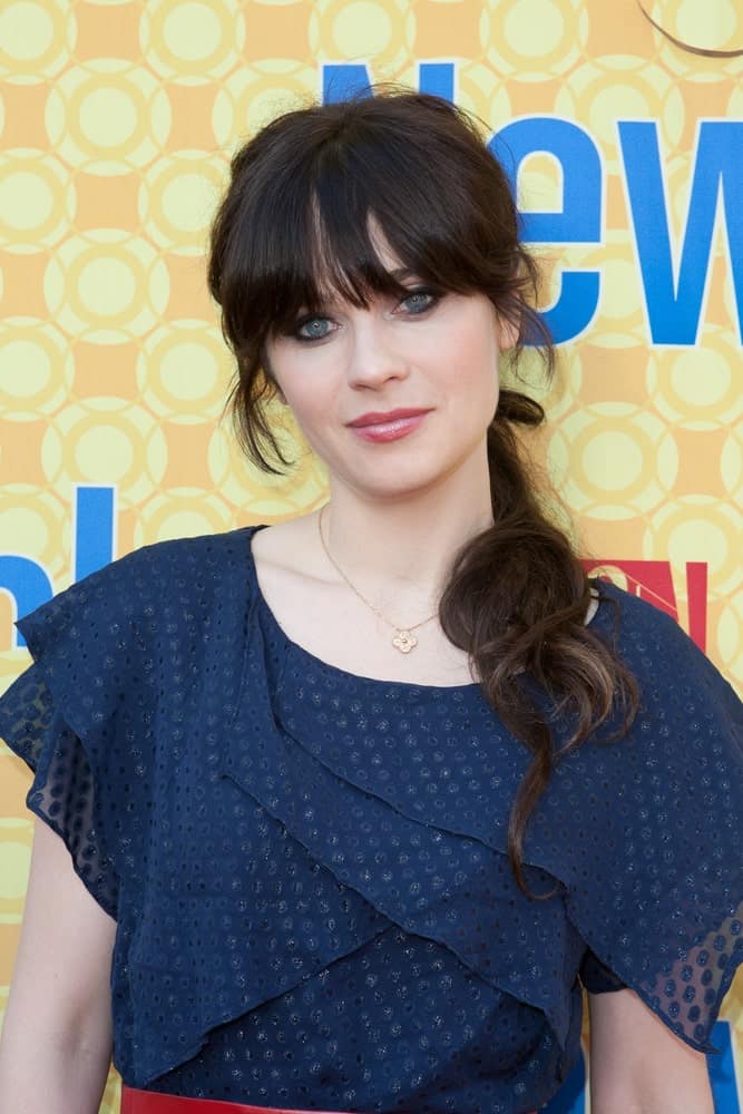 Zooey Deschanel attended The Academy of Television Arts & Sciences' screening of Fox's 'New Girl' at the Goldenson Theatre on May 7, 2012 in North Hollywood, CA. She was seen wearing a blue dress with her messy dark ponytail hairstyle with long bangs.