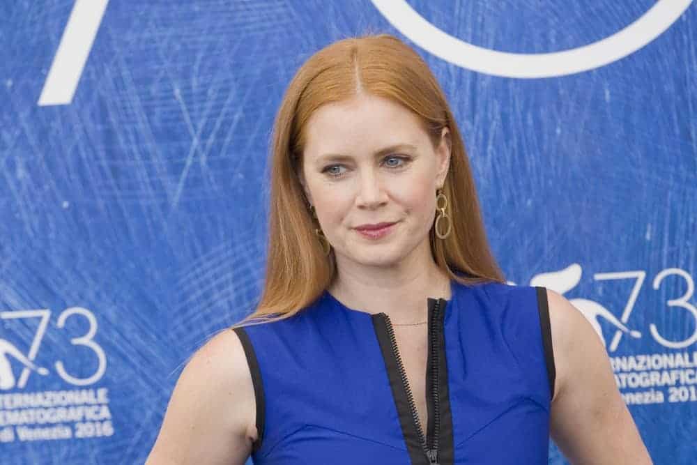 Amy Adams attended a photocall for 'Arrival' during the 73rd Venice Film Festival at Palazzo del Casino on September 1, 2016, in Venice, Italy. She came wearing a blue dress with her long and straight red hair tucked behind her ears.