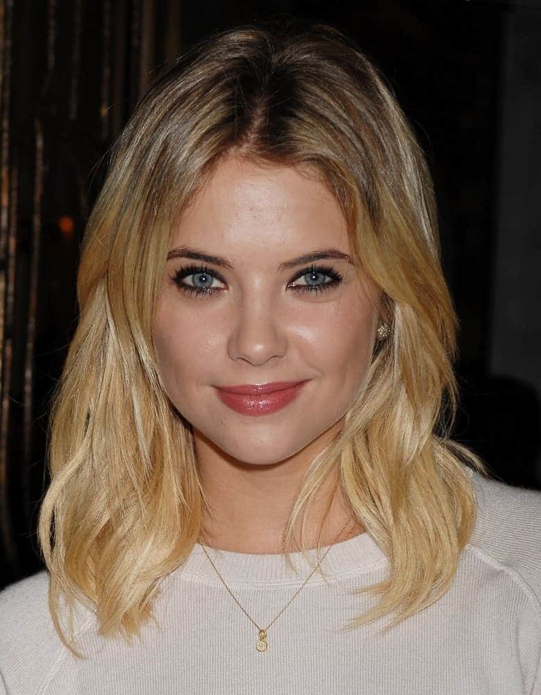 Ashley Benson arrived at the Monika Chiang Store One Year Anniversary Party on December 5, 2012, in Los Angeles, CA. She wore a white sweater to go with her loose and layered shoulder-length blonde hairstyle with subtle waves.