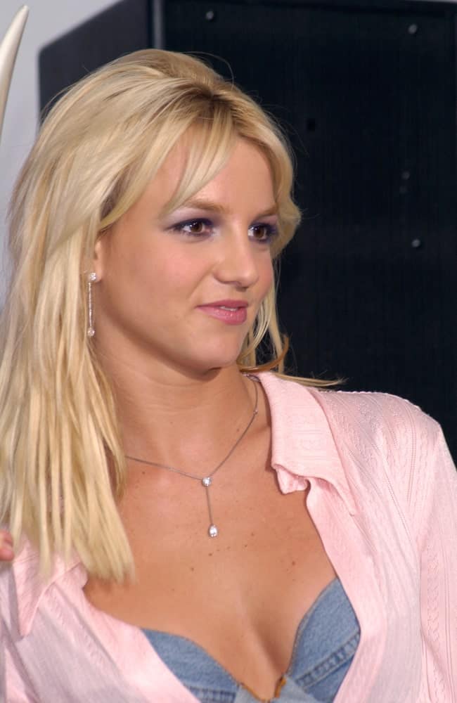 Britney Spears with loose hairstyle and some bangs at the 2001 Teen Choice Awards where she won the award for Choice Female Artist on August 12th.