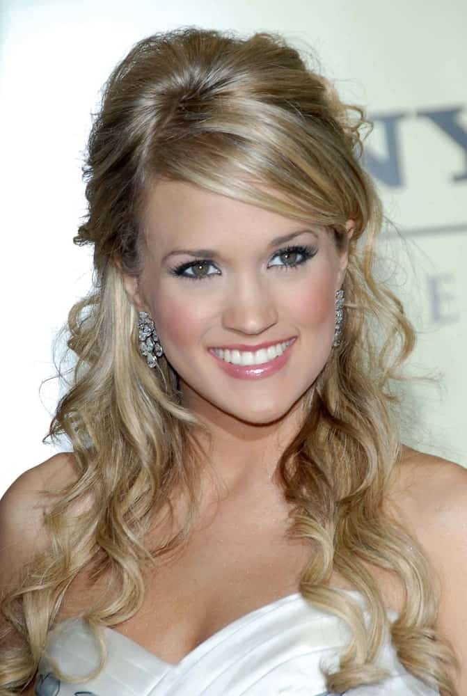 Carrie Underwood styled her long curls with a half updo and side bangs during the 2007 Sony/BMG Grammy After Party on February 11, 2007.