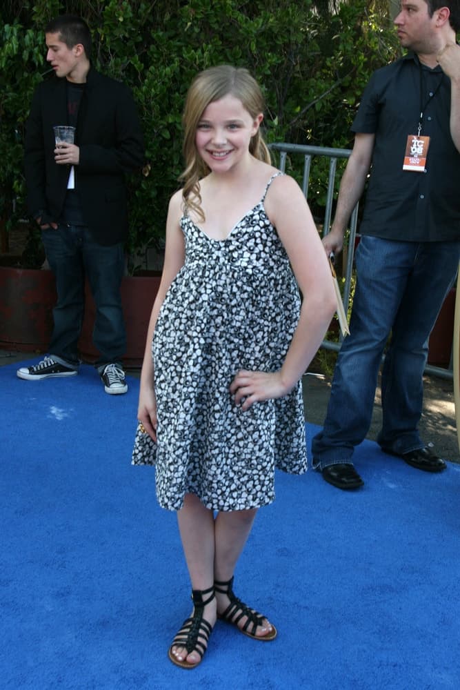 A young Chloe Grace Moretz was at the Teen Choice Awards 2008 at the Universal Ampitheater at Universal Studios in Los Angeles, CA August 3, 2008. She wore a lovely dress with her long sandy blonde hair in a ponytail with long side-swept bangs.