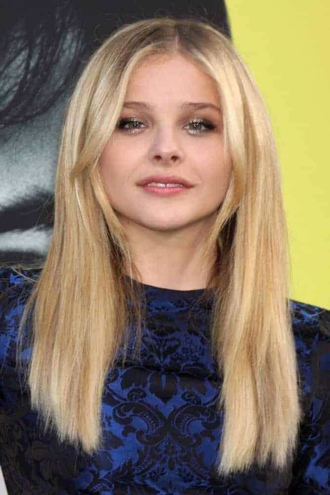 Chloe Grace Moretz was at the "Dark Shadows" Los Angeles Premiere at Grauman's Chinese Theater on May 7, 2012, in Los Angeles, CA. She was stunning in a navy blue patterned dress that made her sandy blonde layers stand out.