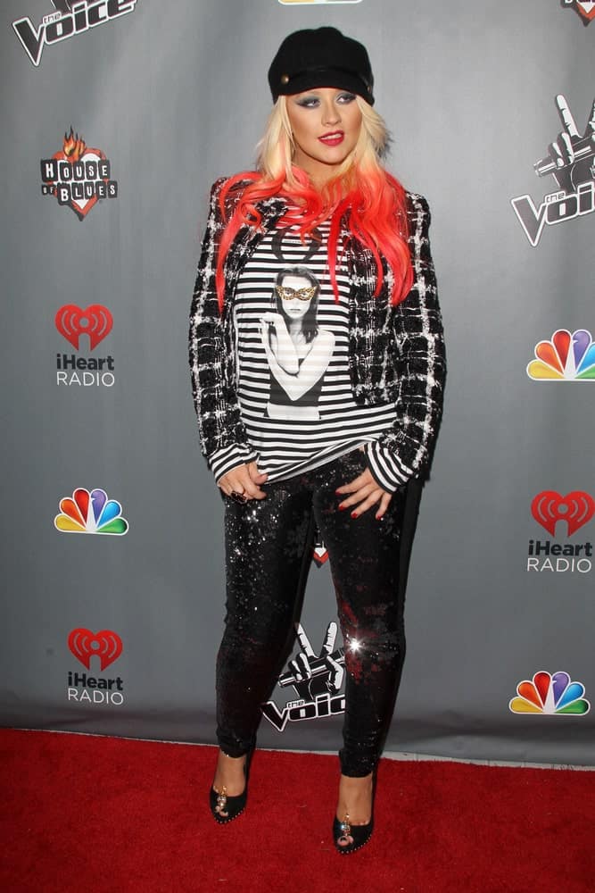 Christina Aguilera is on fire with this red-streaked hairstyle at the “The Voice” Season 3 Top 12 Event held on November 8, 2012.