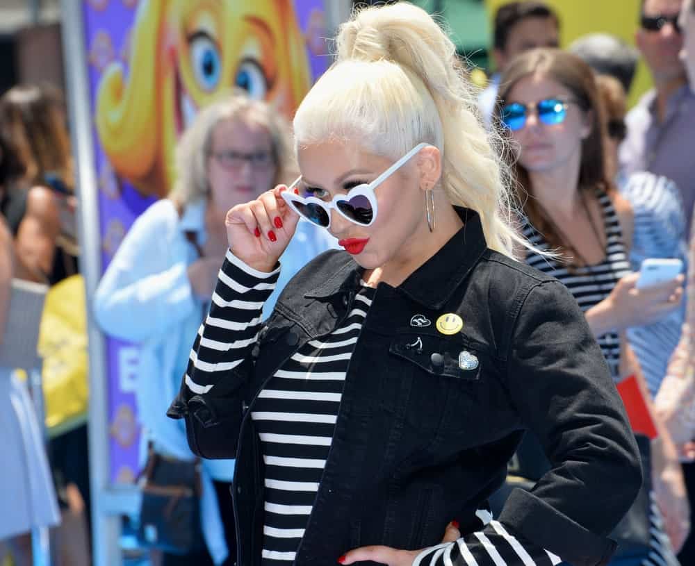 Christina Aguilera looks playful with this long, high ponytail hairstyle at the "The Emoji Movie" World Premiere on July 23, 2017.