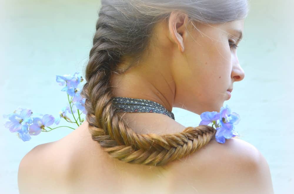 Woman with fishtail braided hair.