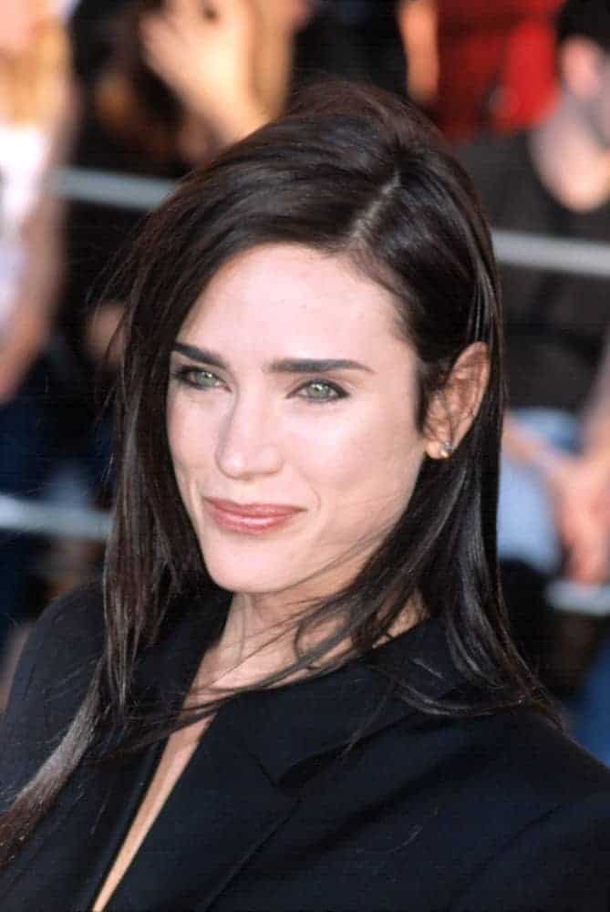 Jennifer Connelly attended the 8th Annual SAG Awards in Los Angels, CA on March 10, 2002. She was seen in a black dress with her shoulder-length layered dark hairstyle with a slight tousle.
