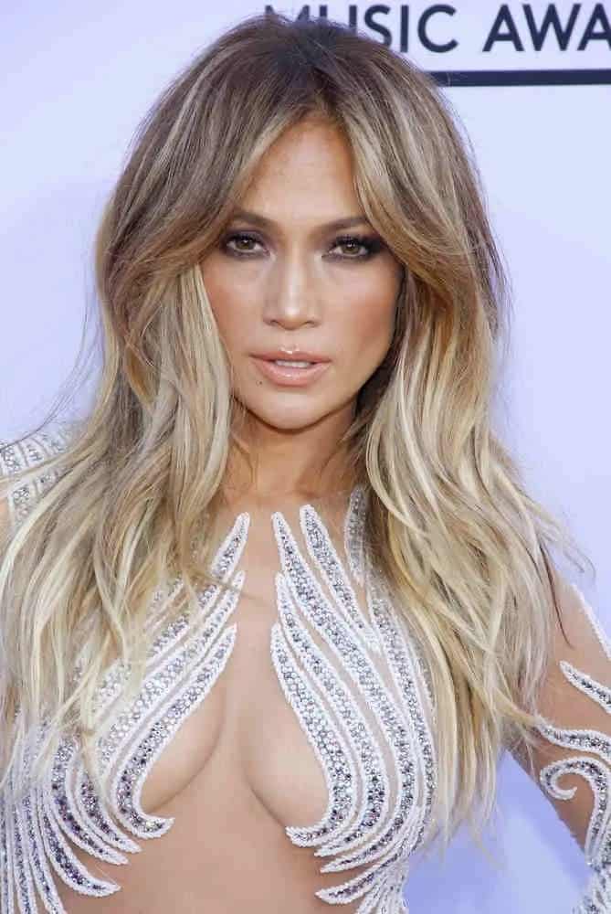 Jennifer Lopez adds some bounce on her loose center-part waves, giving her a fierce look at the 2015 Billboard Music Awards on May 17, 2015.