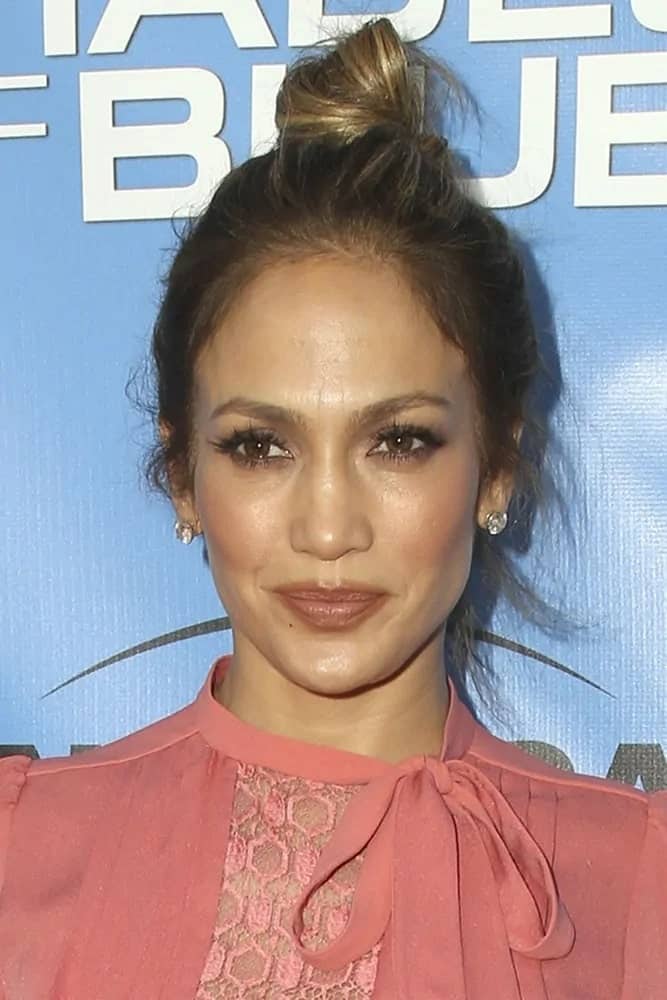 Jennifer Lopez rocks a messy but pretty top knot hairstyle at the Shades of Blue Television Academy Event on June 9, 2016.