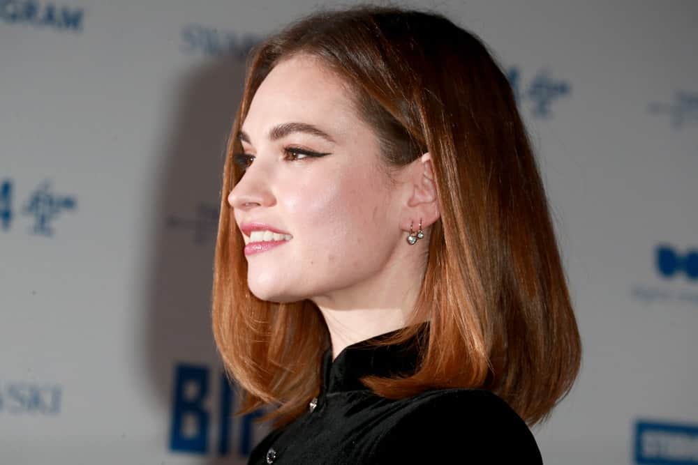 On December 1 2019, Lily James was at the 22nd British Independent Film Awards in London. She wore a black outfit with her auburn shoulder-length bob hairstyle with subtle layers.