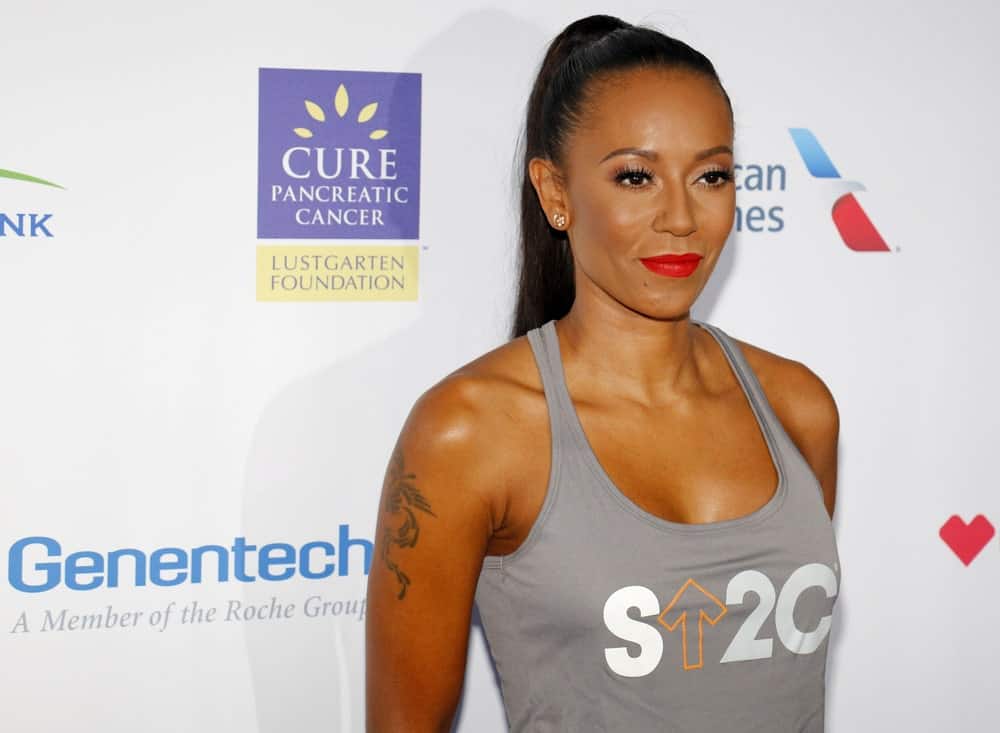 Mel B in a gray tank top and a high ponytail hairstyle at the 5th Biennial Stand Up To Cancer held on September 9, 2016.