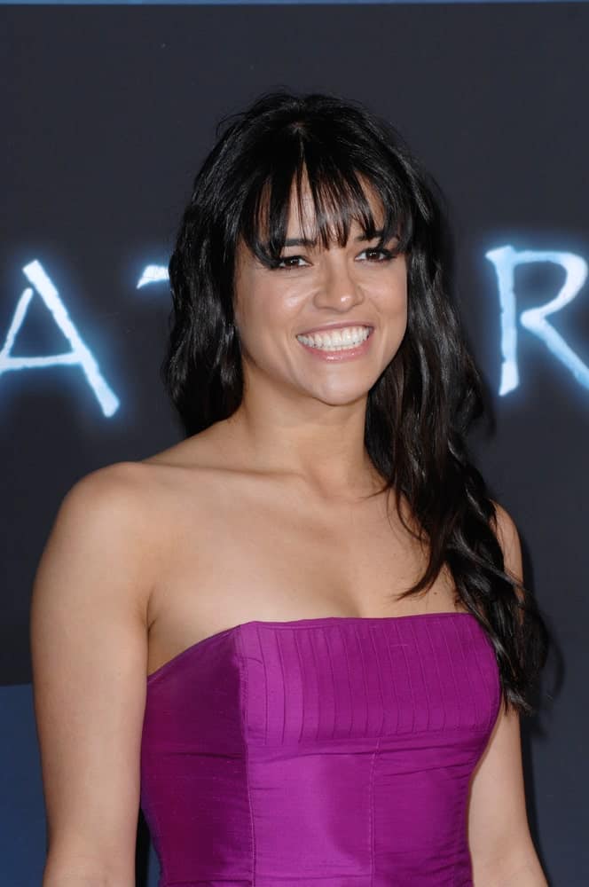 Michelle Rodriguez complements her long, jet black waves with full bangs during the Los Angeles premiere of her new movie “Avatar” on December 16, 2009.