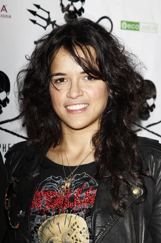 Michelle Rodriguez rocks a tousled curly hairstyle with side bangs during the Animal Planet's 'Whale Wars' + Sea Shepherd Conservation Society event for 'Operation No Compromise' on October 23, 2010.