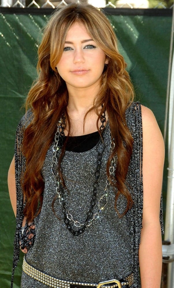 Miley Cyrus had a long layered and highlighted wavy hairstyle at The Elizabeth Glaser Pediatric AIDS Foundation 20th Annual A Time for Heroes Celebrity Carnival, Wadsworth Theater in Los Angeles on June 7, 2009.