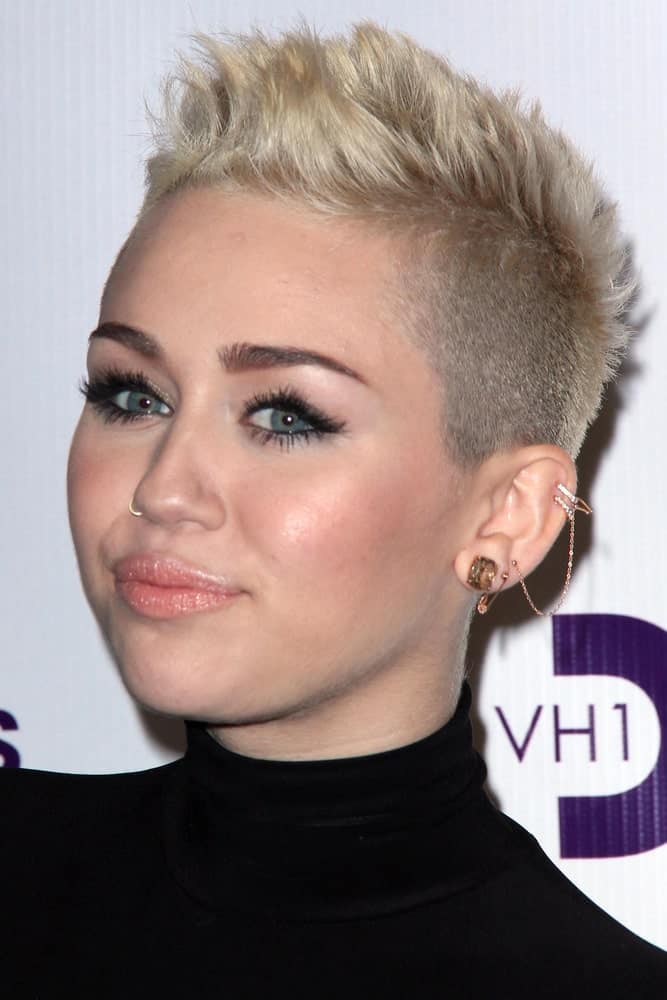 Miley Cyrus wowed everyone with her sexy tight black dress and spiked platinum blond hairstyle at the VH1 Divas Concert 2012 at Shrine Auditorium on December 16, 2012 in Los Angeles, CA.