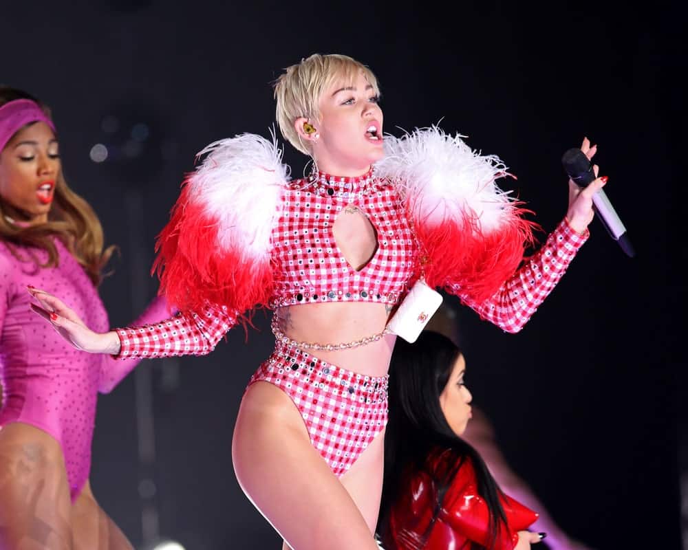 Miley Cyrus performed in concert at the Barclays Center on April 5, 2014 in Brooklyn, New York. She was sexy in her two-piece skimpy outfit that she paired with her tousled side-swept pixie hairstyle with bangs.