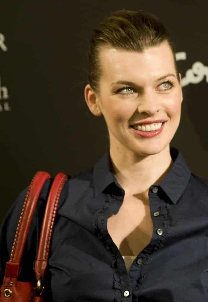 Milla Jovovich was at the presentation of the new Tommy Hilfiger complements collection on March 18, 2010, in Madrid. She was lovely in a dark outfit to pair with her slicked-back neat hairstyle and simple makeup.