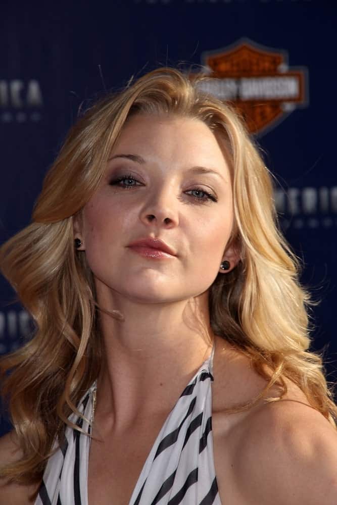 Natalie Dormer wore a printed halter dress that perfectly goes with her bouncy waves at the Los Angeles Premiere Of "Captain America: The First Avenger," held at El Capitan, Hollywood, CA on July 19, 2011.