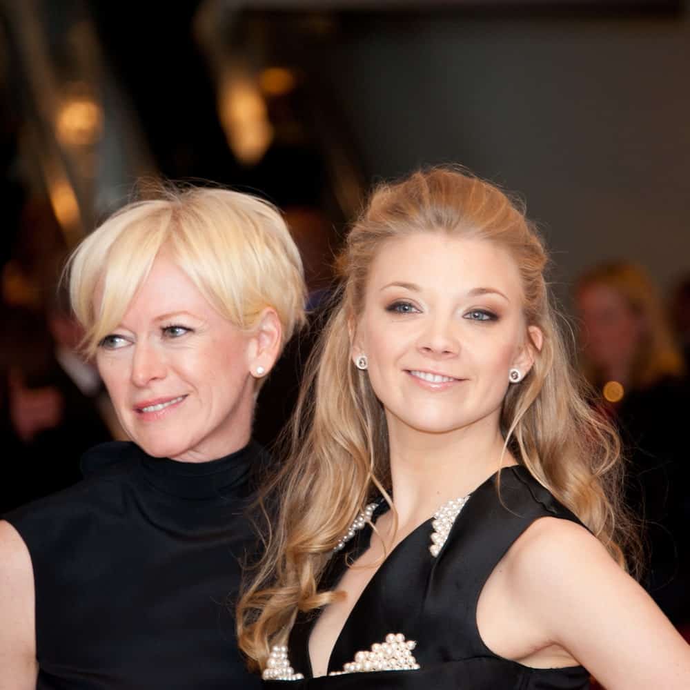 Natalie Dormer with Joanna Coals at the White House Correspondents Dinner on April 27, 2013. Natalie sported a tousled slicked half updo paired with a black embellished dress.
