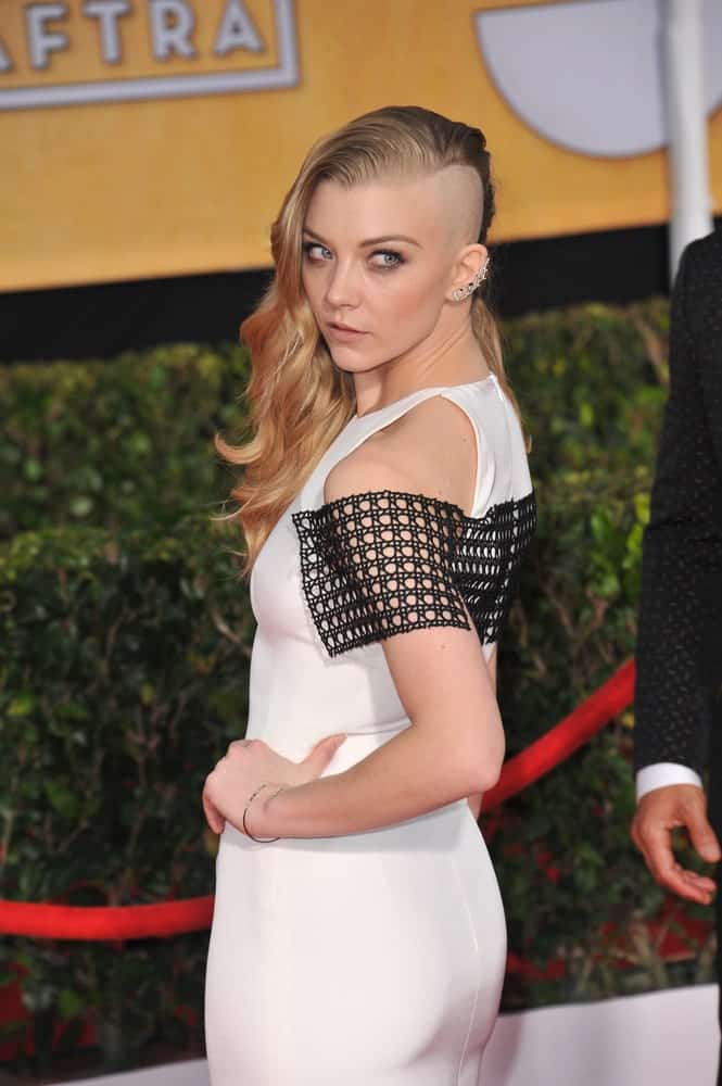 On January 18, 2014, Natalie Dormer attended the 20th Annual Screen Actors Guild Awards at the Shrine Auditorium. She channeled her inner badass with an edgy side-swept hairstyle where the left side of her head is shaved.