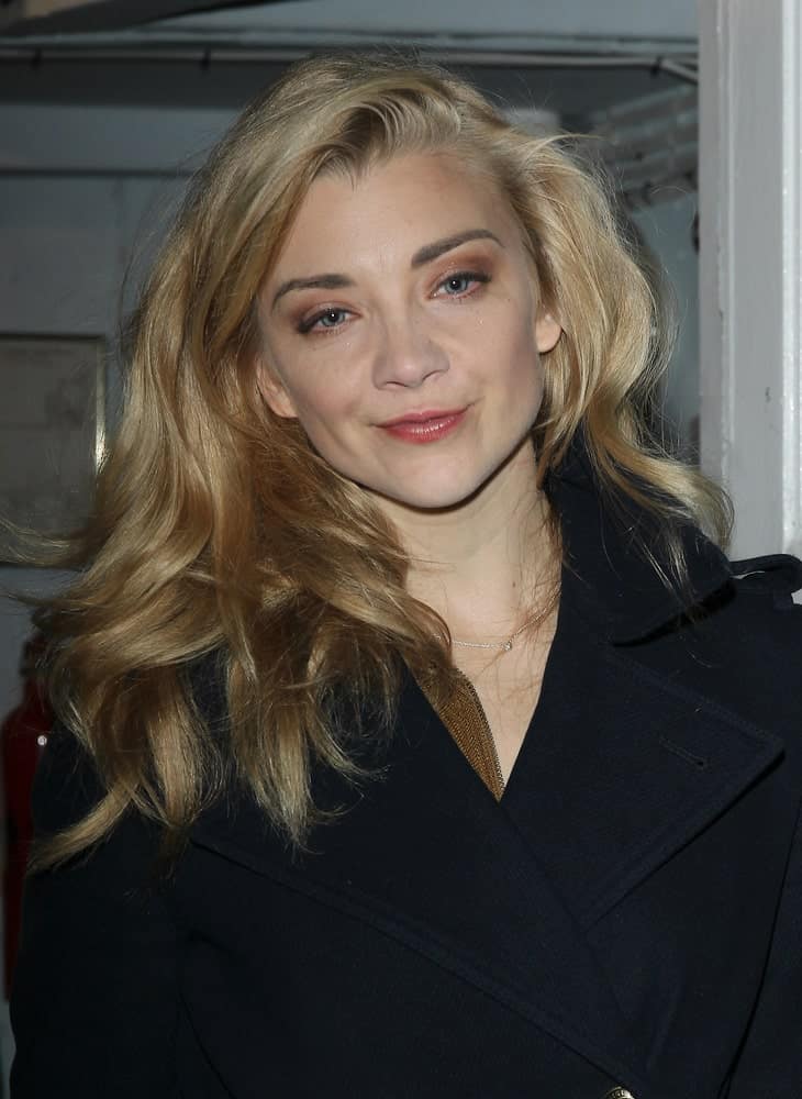 Natalie Dormer wearing a black coat and a voluminous side-swept hairstyle as she leaves the Theatre Royal in London last October 27, 2017.