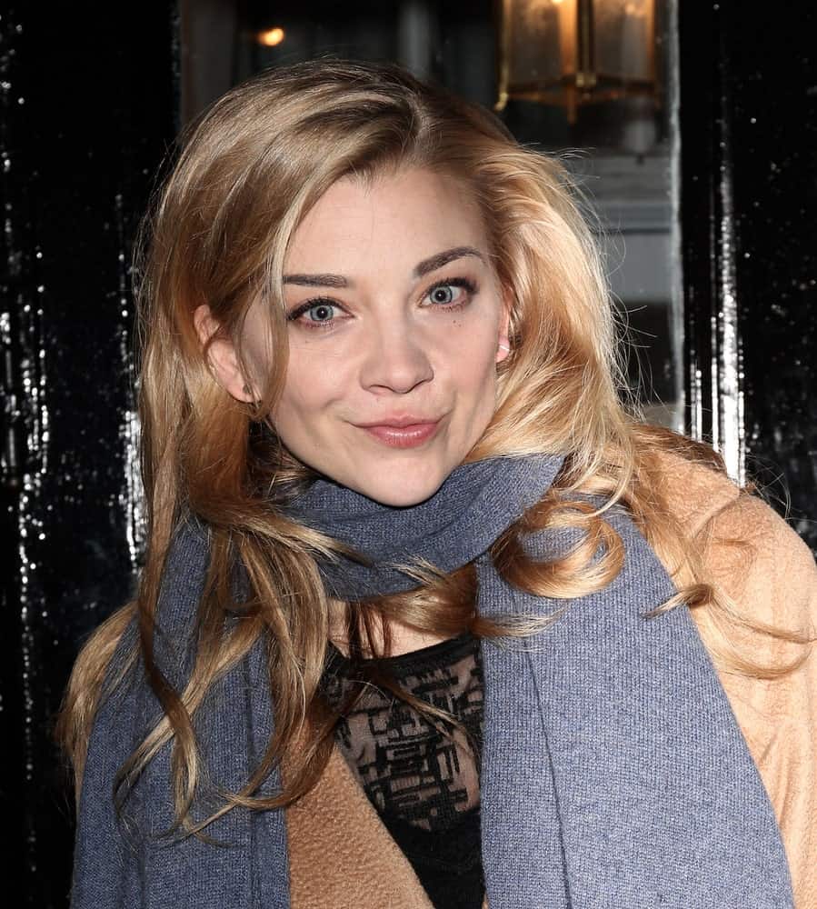 Natalie Dormer was seen leaving the Theatre Royal Haymarket in London on November 29, 2017. She was wearing a brown coat and gray scarf along with a loose side-parted hairstyle.