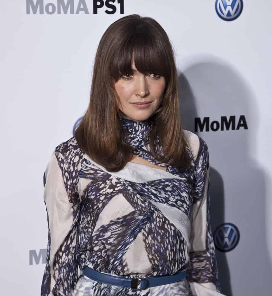 Rose Byrne attended the MoMA launch of partnership between Volkswagen and Museum of Modern Art on May 23, 2011 in New York City. She wore a fashionable dress with her long ans straight dark brunette hairstyle with long eye-skimmer bangs.