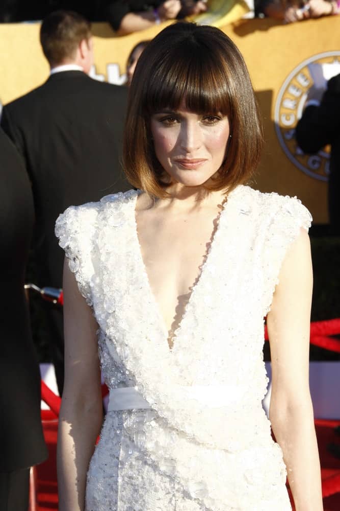 Rose Byrne was at the 18th annual Screen Actor Guild Awards at the Shrine Auditorium on January 29, 2012 in Los Angeles, California. She was stunning in a white dress that paired well with her chin-length straight bob hairstyle with blunt bangs and highlights.